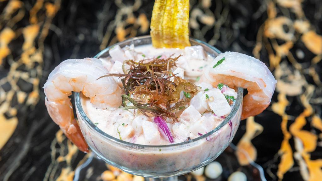 Leche De Tigre · Combination of seafood blended with lime juice.