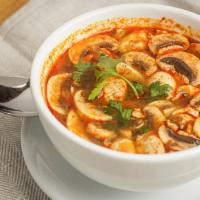  Tom Yum (Spicy Shrimp Soup) · The most famous Thai traditional spicy soup with shrimp,
galangal, mushroom, lemongrass, cil...