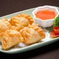 Curry Puff · Soft and puffy pastry filled with minced chicken, curry powder,
diced potato, and onion serv...