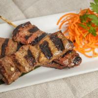 Grilled Pork · Thai style marinated pork served on a skewer served with Thai
spicy sauce.