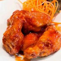 Sriracha Wings · Spicy fried crispy siracha wings.