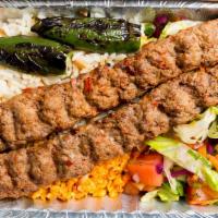 Adana Kebab · Skewered ground meat charcoal broiled.