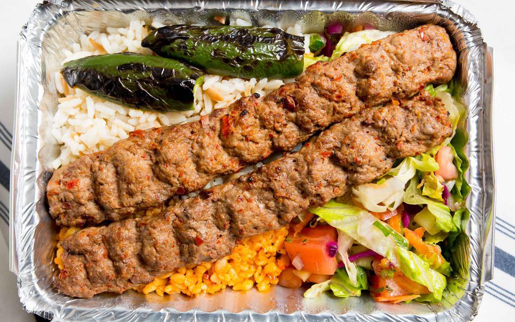 Adana Kebab · Skewered ground meat charcoal broiled.
