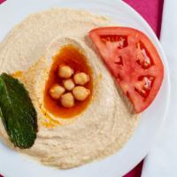 Hummus · Pureed chickpeas with sesame oil and a hint of garlic.
