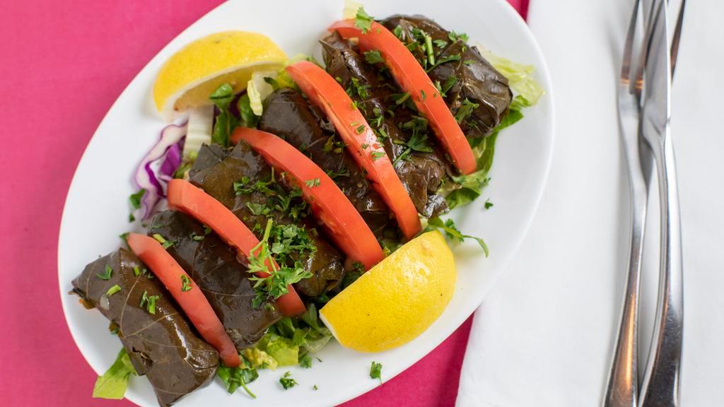 9- Grape Leaves · Grape leaves stuffed with rice, herbs, spices, parsley and onion