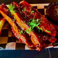 Luis Style Ribs · Our Mouthwatering BBQ ribs served with hour slaw and a pickle.