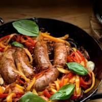 Sausage And Peppers · Grilled Italian sausage on a fresh baked Italian bread filled with peppers, onions, and Mama...