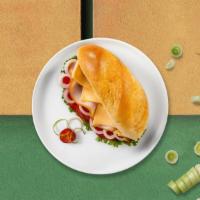 Abe Lincoln Mc Sandwich · Mesquite smoked turkey gouda cheese with lettuce, tomato & honey mustard.