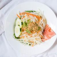 Green Papaya Salad · With string beans, tomato and peanut with chili lime dressing.