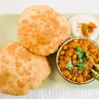Chole Bhatura · Spicy chickpeas curry served with fried & fluffy Indian bread.