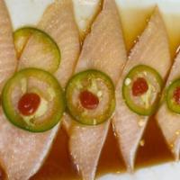 Yellowtail Jalapeño · Sliced yellowtail and fresh jalapeño topped with yuzu and chili sauce.