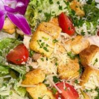 Caesar Salad · Chopped greens tossed with Caesar dressing, topped with grilled chicken and baby tomatoes.