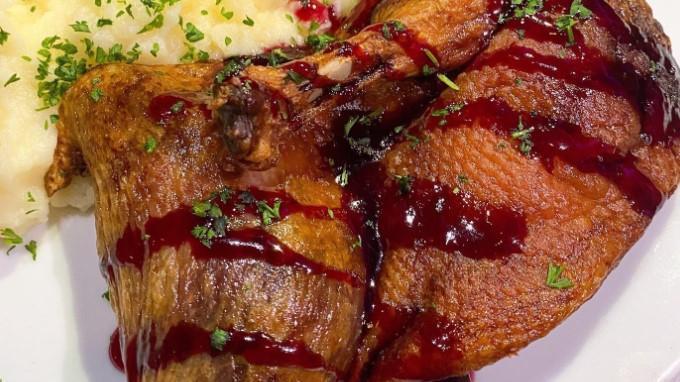 Duck · 1/2 duck baked, served with house berry sauce.