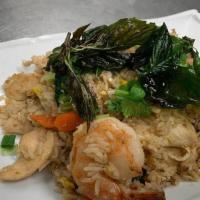 Basil Fried Rice. · Stir fried rice with egg, garlic, chili, carrot, onion and basil.