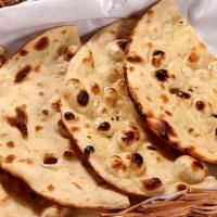 Tandoori Roti · Flatbread made with whole wheat and traditionally cooked in Tandoor oven