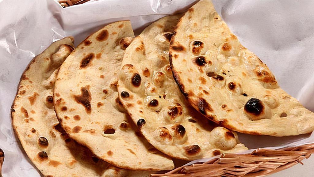 Tandoori Roti · Flatbread made with whole wheat and traditionally cooked in Tandoor oven