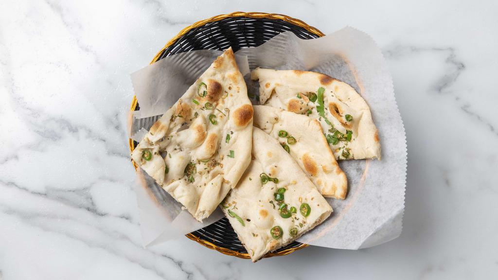 Bullet Naan (Spicy) · Tandoor baked white flour bread seasoned with green chilis & cilantro
