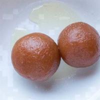 Gulab Jamun · This is a traditional indian dessert. Spongy milky dumplings soaked in rose scented syrup.