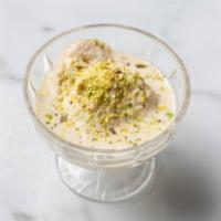 Kheer / Ras Malai · Rice pudding / grated carrots, whole milk, dried fruit, and nuts / bengali dessert made with...