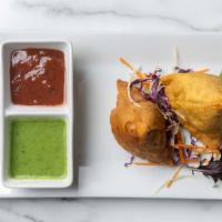 Samosas · Indian fried pastry with a savory filling of spiced potatoes, onions, peas and lentils (2 pc...