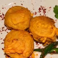 Batata Vada · Popular indian vegetarian fast food, deep fried savory appetizer made with spicy potato mix ...
