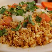 Bombay Bhelpuri · Delicious mixture of puffed rice, sev, tomato, potato, onion and sweet-sour-spicy chutneys. ...