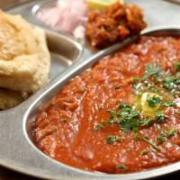 Pav Bhaji · Pav bhaji is a spicy blend of vegetables in tomato gravy served with pav (buttered buns). (S...
