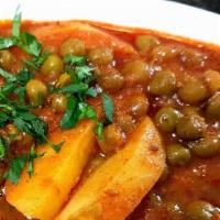 Alu Matar · Potato, green peas in mildly spiced tomato sauce. (Gluten Free).