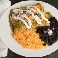 Enchiladas · Two rolled oven baked corn tortillas topped with cheese, mole or verde sauce, crema fresca, ...