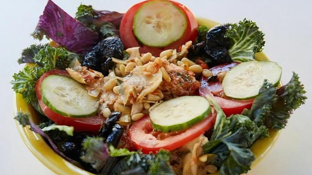 Kale Salad · Marinated artichokes, Roma tomatoes, kale, cucumbers, oil cured black olives, pine nuts and white balsamic.