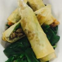 Duck Spring Roll · Spring roll filled with sliced duck and scallions.