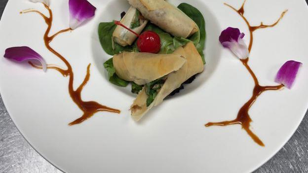 Salmon Spring Roll · Fried spring roll stuffed with salmon, cream cheese, and asparagus.