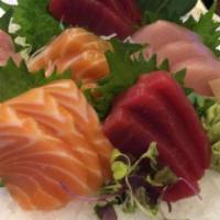 Triple Delight Sushi: Tuna, Salmon, & Yellowtail Sushi · Four pieces each.