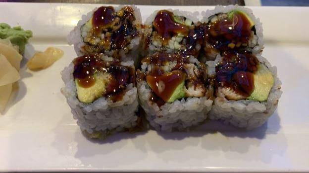 Unagi Roll · Inside out with eel and cucumber topped with kabayaki sauce.