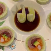 Naruto Maki · Tuna, salmon, yellowtail, avocado, masago, rolled with sliced cucumber with ponzu sauce.
