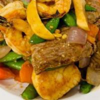Surf & Turf · Hot and Spicy. Sautéed jumbo shrimp, scallop, beef with carrots, sugar snap peas and mushroo...