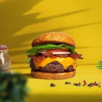 Vegan Kevin Bacon Burger · Seasoned plant-based patty topped with melted vegan cheese, layers of crispy vegan bacon, le...