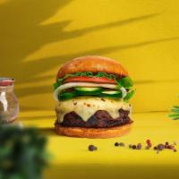 Jalapeno Joy Vegan Burger · Seasoned plant-based patty topped with melted vegan cheese, jalapenos, lettuce, tomato, onio...