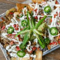 Nachos · Your choice of ingredient plus tortilla chips, beans, cheese, jalapenos, pico de gallo and s...