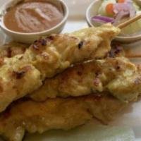 Satay · Marinated chicken on skewer, served with peanut sauce and cucumber sauce.