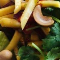 Mango Salads · Shredded mango, red onion, carrot, cashew nuts with spicy lime juice. Spicy.