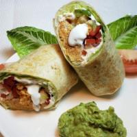 Grilled Chicken Burrito
 · Flour or Whole Wheat tortilla filled with chicken, rice, beans, lettuce cheese and sour crea...