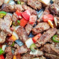 Bistec A La Mexicana Burrito · Flour or Whole Wheat tortilla filled with steak with onions jalapenos and tomatoes, rice, be...