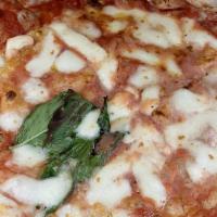 Margherita Pizza · San Marzano tomatoes, fresh mozzarella, basil, Parmigiano Reggiano D.O.P., and extra virgin ...