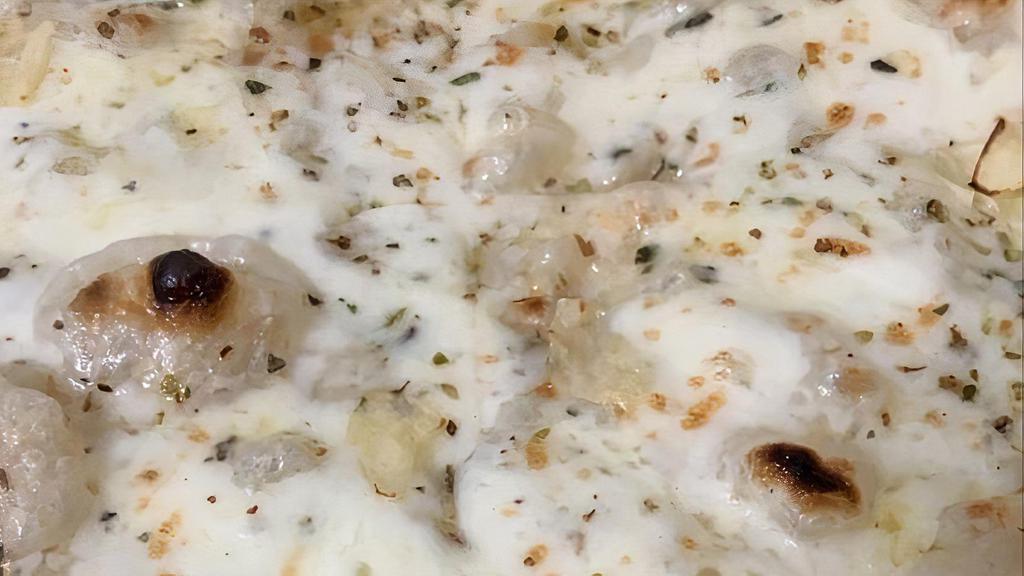 Bianca Pizza · Fresh mozzarella, garlic, oregano, Parmigiano Reggiano D.O.P, and extra virgin olive oil.