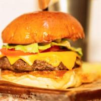 Classic Burger · American cheese, lettuce, tomato, red onion, ainsworth sauce on a brioche bun.