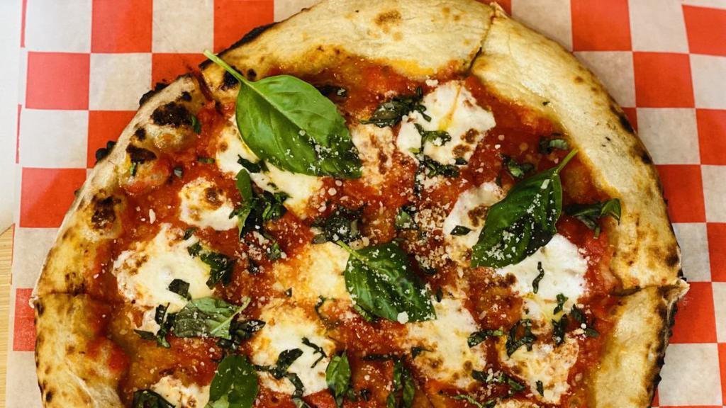 The Margherita Pizza · Tomato sauce, house-made mozzarella, basil.