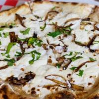 The White Pie Pizza · House made mozzarella, lemon ricotta, caramelized onion, pecorino Romano.