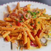 Penne Vodka · Penne served with sautéed bacon in a vodka pink cream sauce.