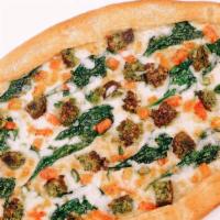 Veggie Pide (Mediterranean Style Pizza) · Falafels, spinach, tomatoes, scallions, parsley, and mozzarella.